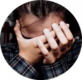 person-holding-their-head-in-their-hands-close-up_480x480